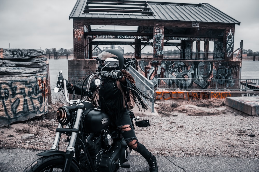 woman riding on cruiser motorcycle during daytime