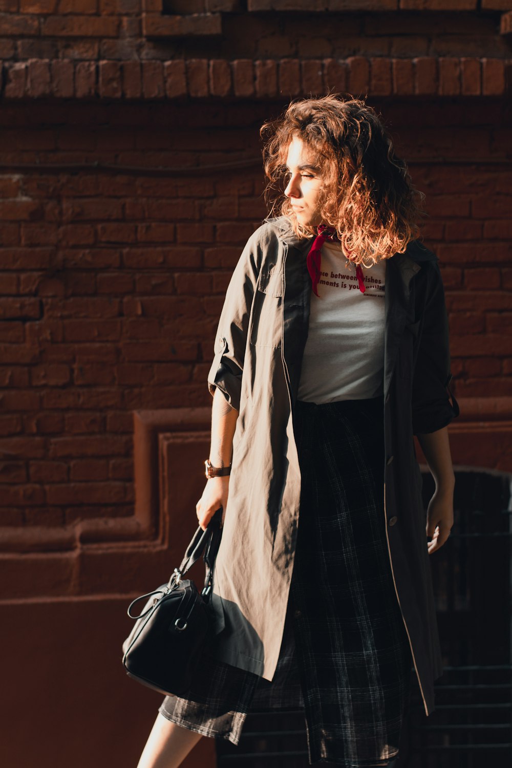 woman wearing gray trench coat