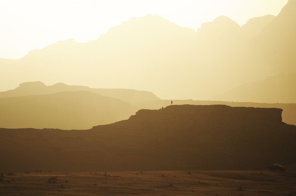 silhouette photography of mountain during daytime