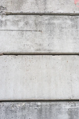Finished concrete slabs laid out as flooring in a modern building.