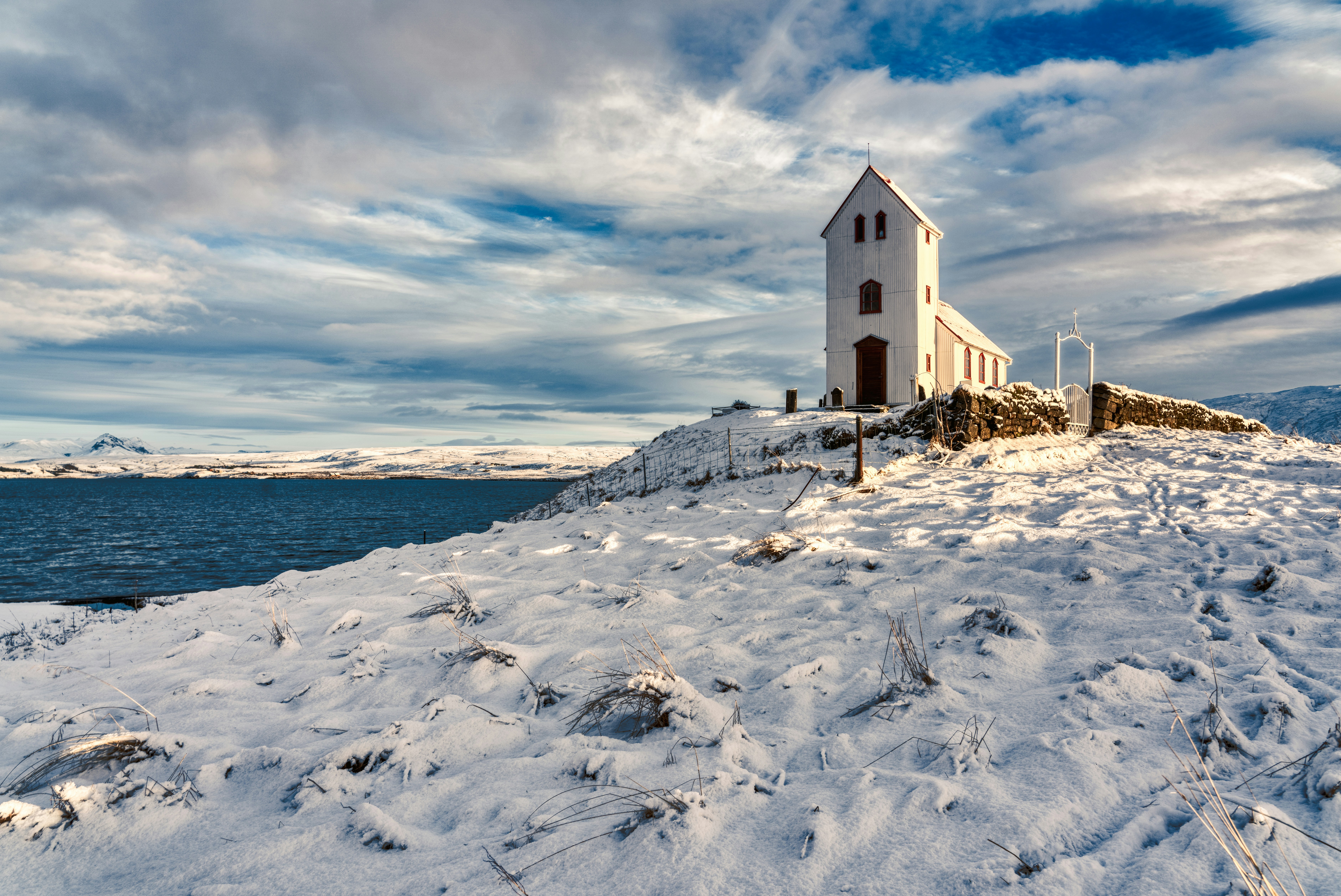 white concrete building during daytime wintertime teams background