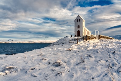 white concrete building during daytime wintertime teams background