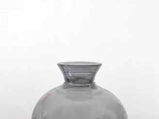 A clear glass vase showcasing minimalist modern design with clean lines and subtle curves.