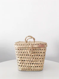 Decorative woven basket perfect for stylish storage and organization.