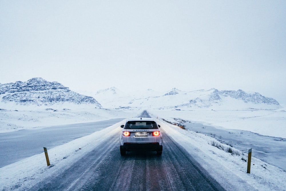 gray car near snow covered mountain