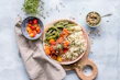 Flat lay of a colorful meal prep with fresh vegetables and lean proteins on a wooden table