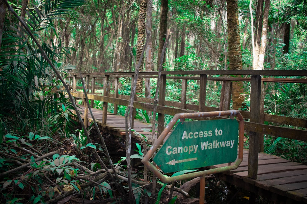 access to canopy walkway signboard pointing to left