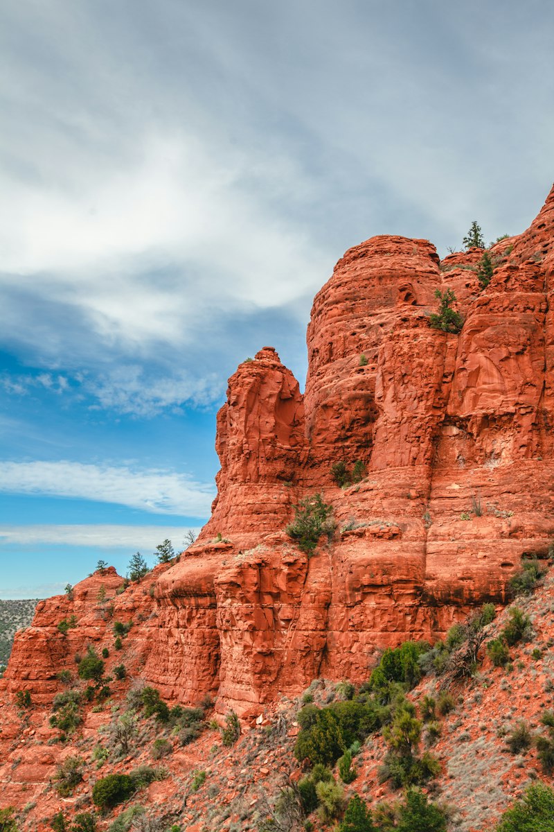 Brown mountain under blue sky at Red Rock State Park in Sedona Arizona