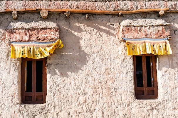 Detail of rustic curtain accessories and mechanisms enhancing window decor.