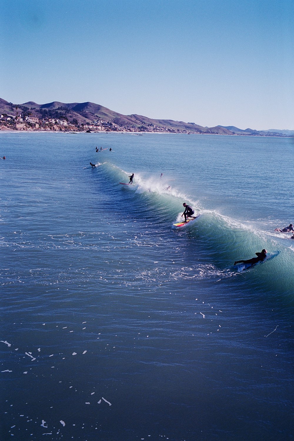 people surfboarding during daytime