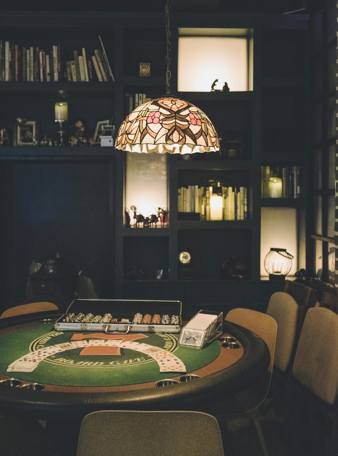 tiffany pendant lamp near poker table