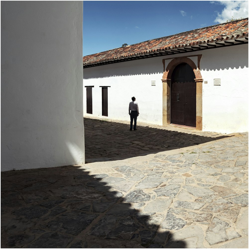 man looking at brown roof