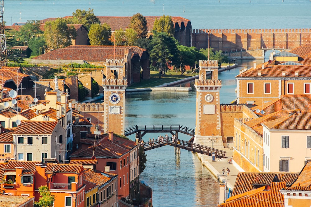 brown and white concrete buildings and bridge during daytime