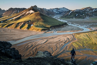 man standing on the edge of a cliff