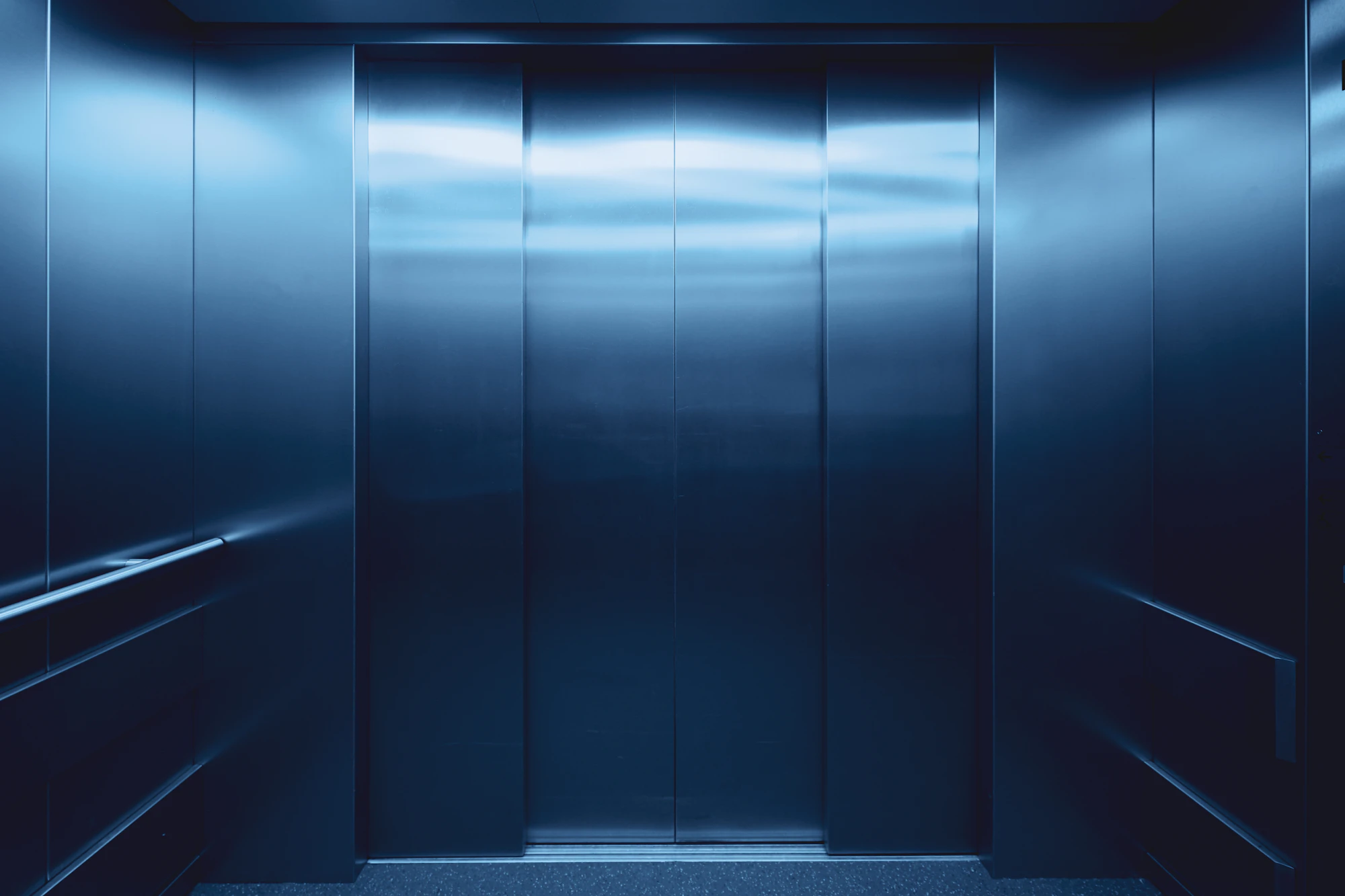 Premium modern elevator with stainless steel doors inside a luxury building