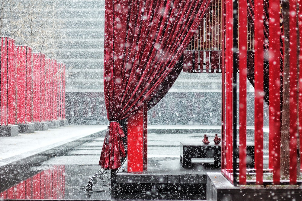 selective focus photography of red panel curtains