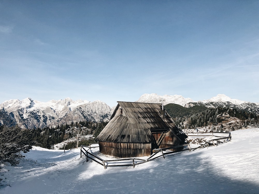 hut on snow covered ground on daylight