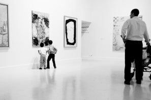 Parents and children happily waiting in a cozy, welcoming reception area decorated with playful art.