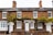 brown concrete 2-storey house