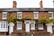 brown concrete 2-storey house