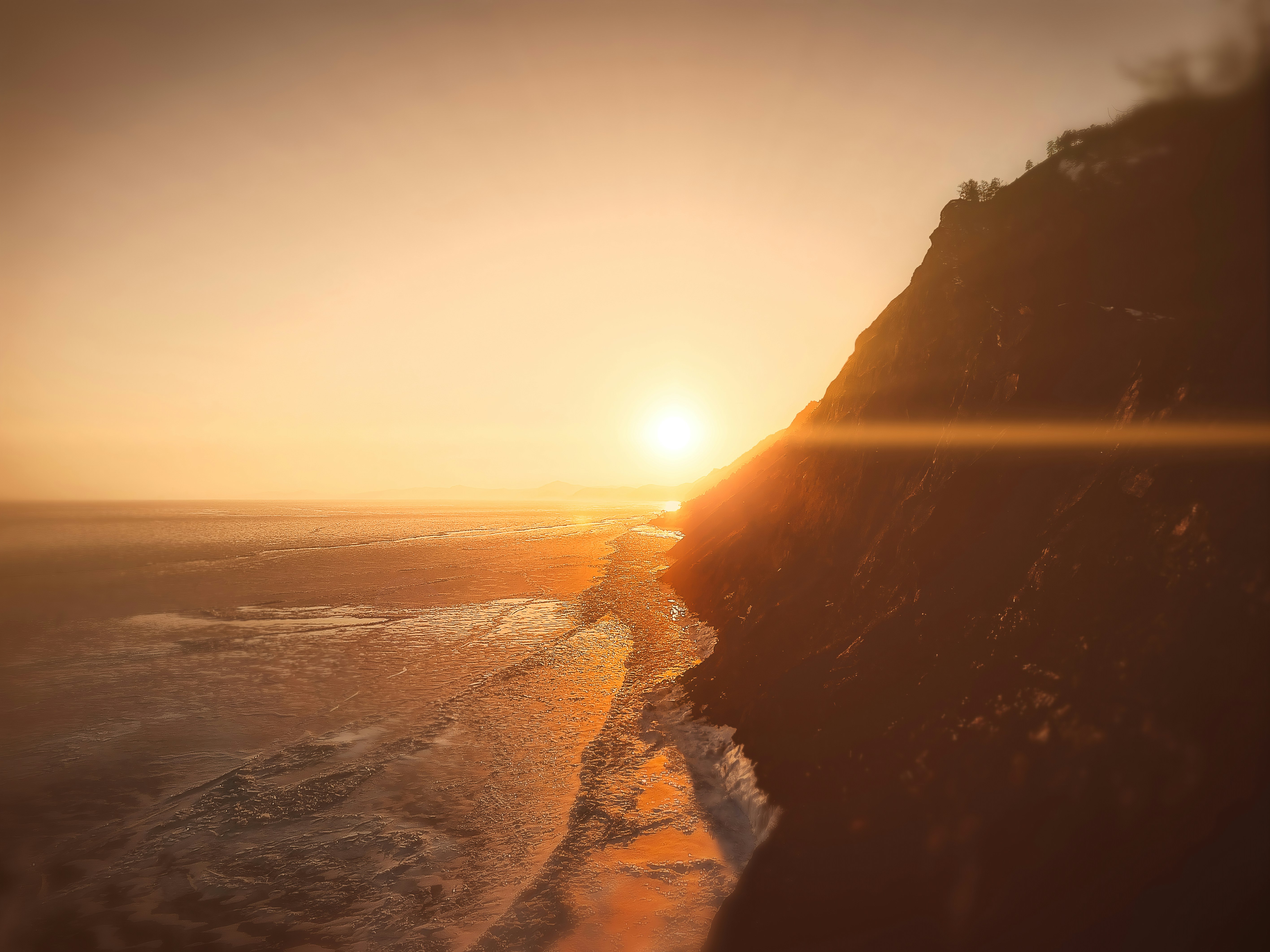 rock formation front of sea during golden hour