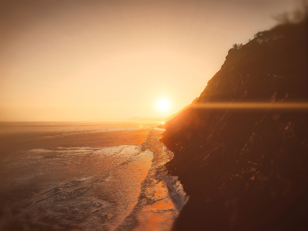 rock formation front of sea during golden hour