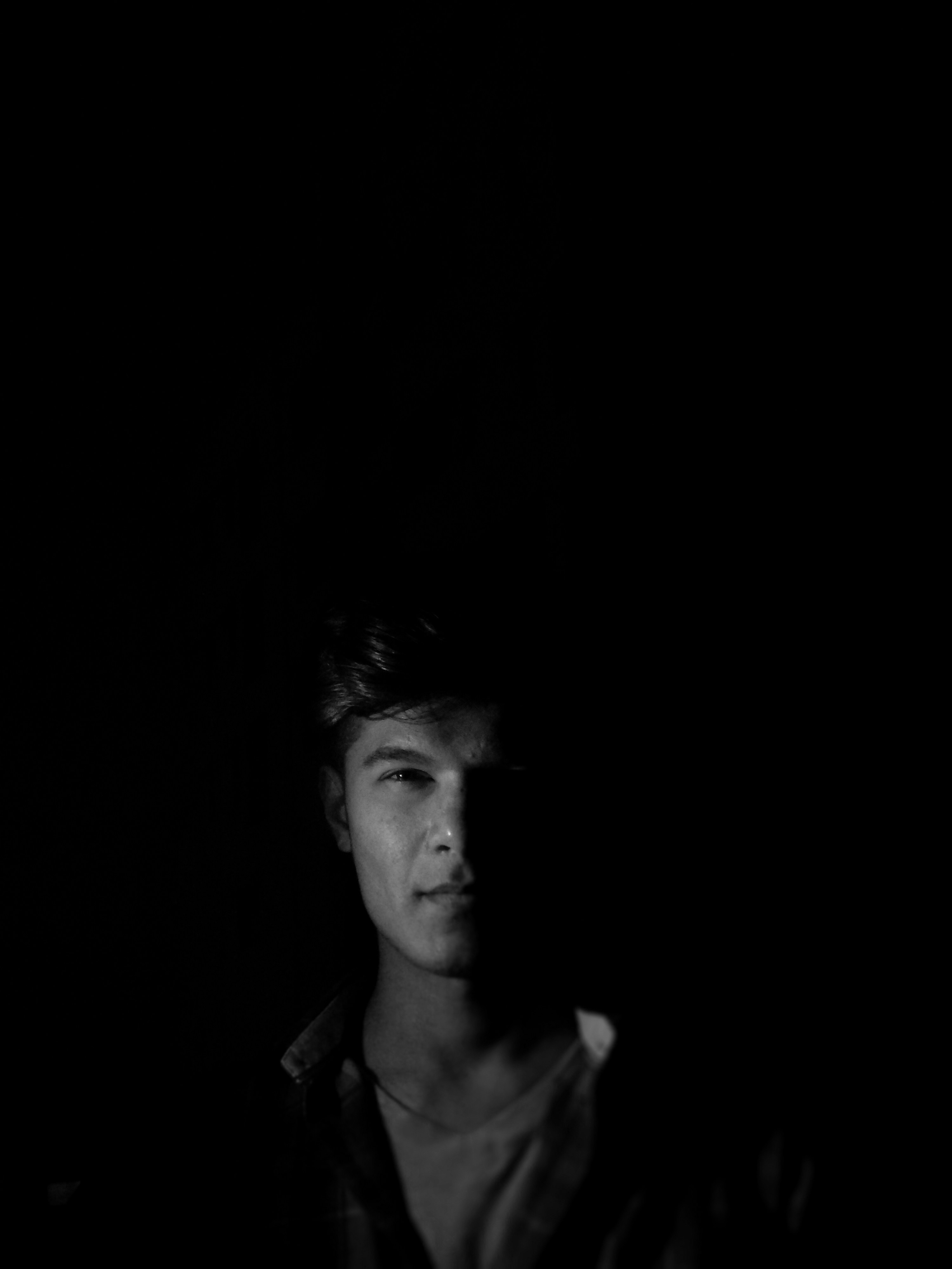 man in shirt smiling grayscale photography