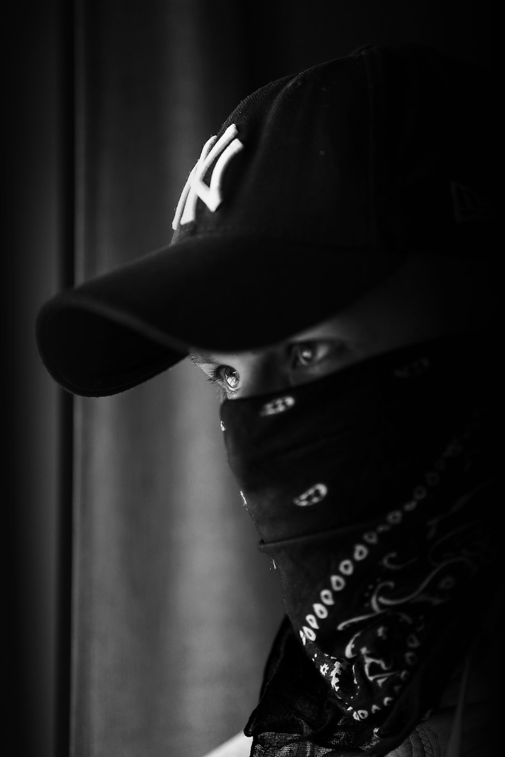 grayscale photo of man with bandana