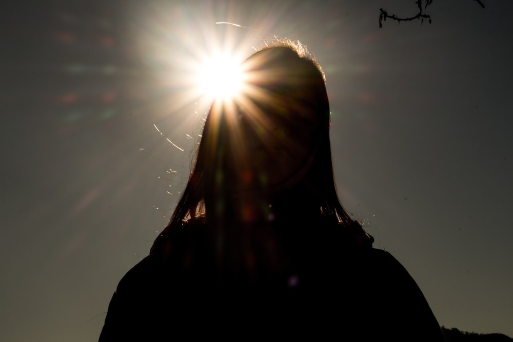 silhouette of person standing during daytime