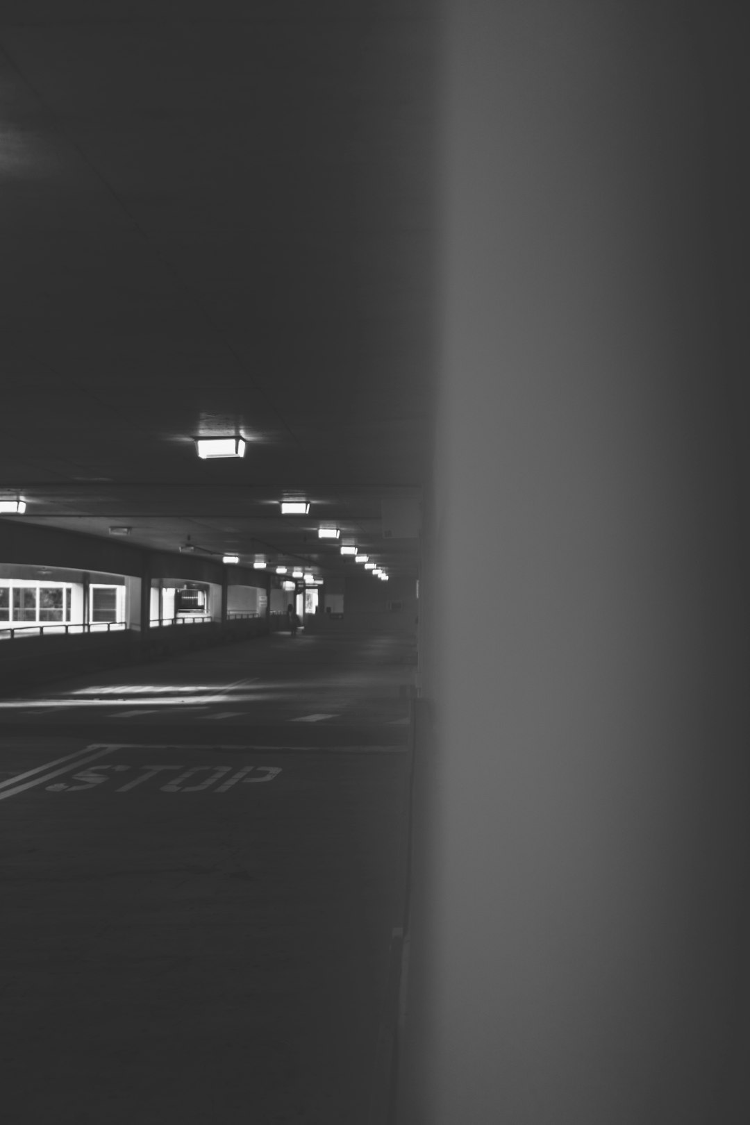 grayscale photography of tunnel