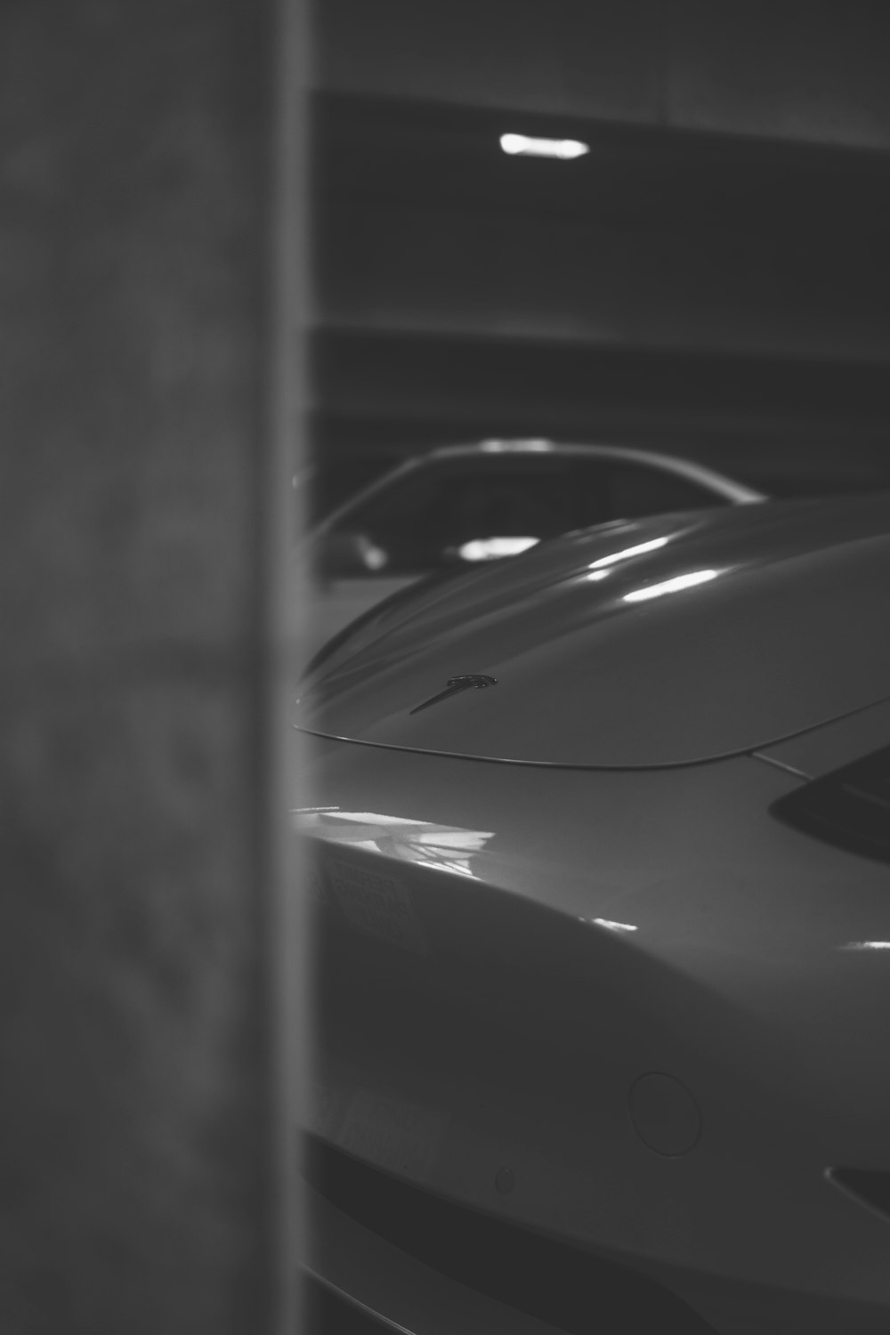 grayscale photo of car hood