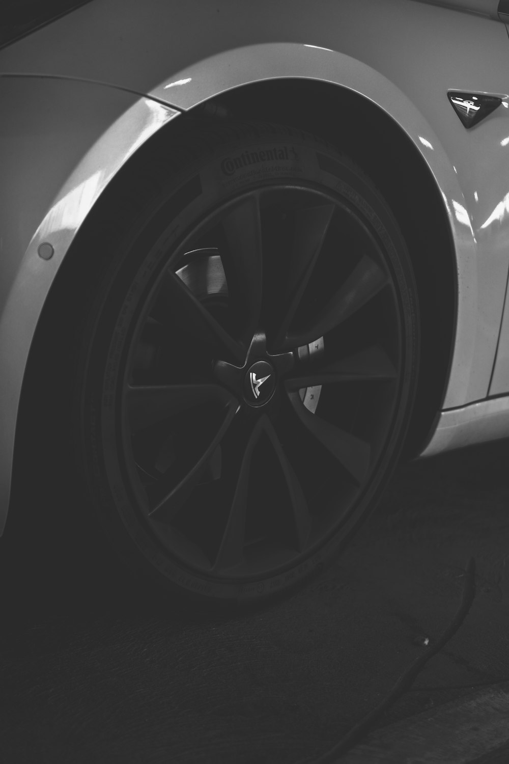 black multi-spoke vehicle wheels and tire