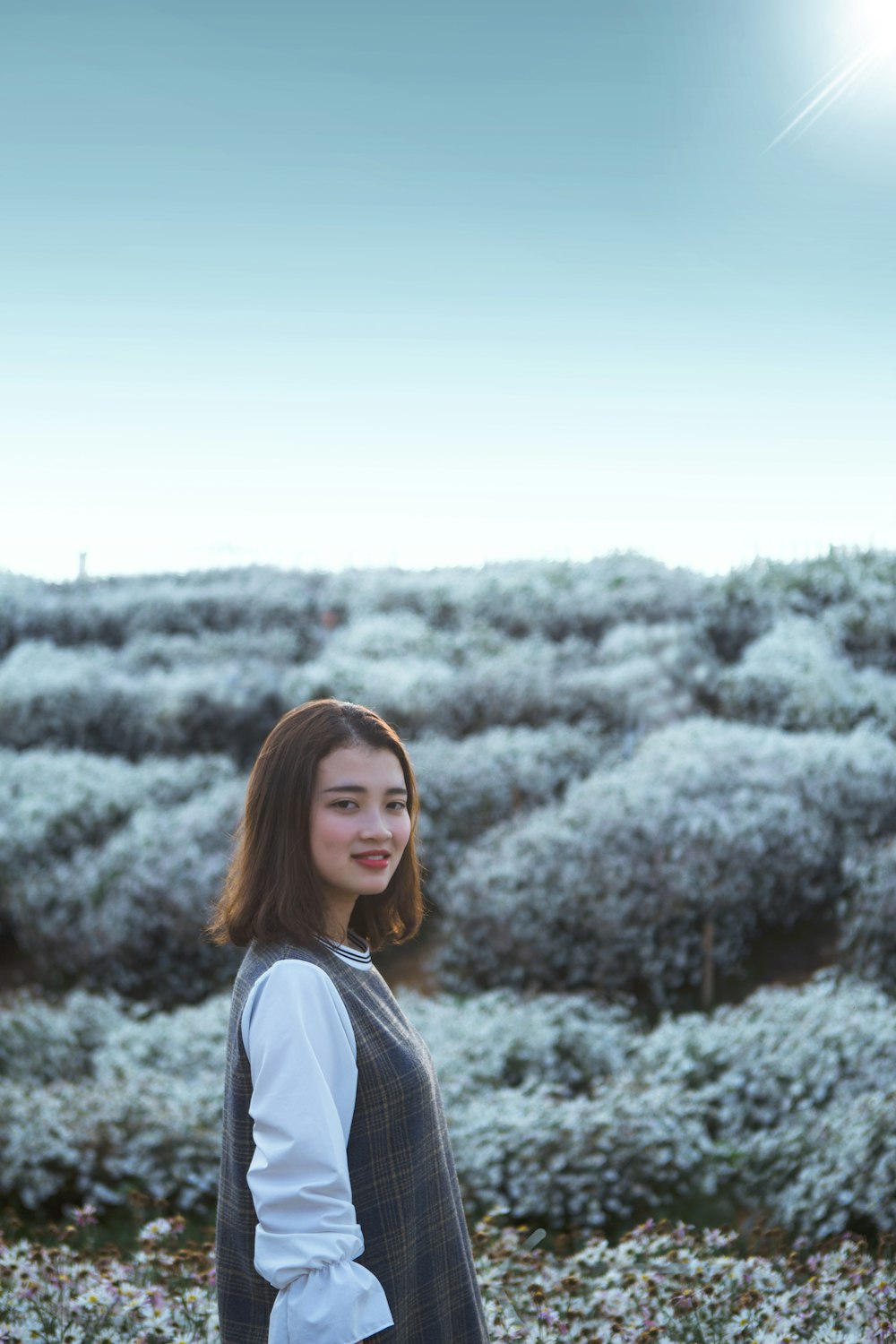 woman in grey and white top