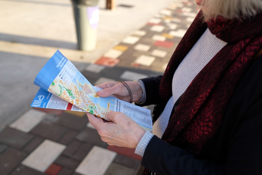 standing woman holding map