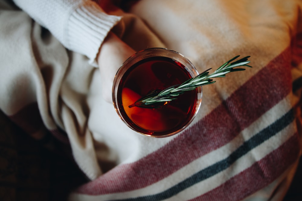 person holds glass of tea