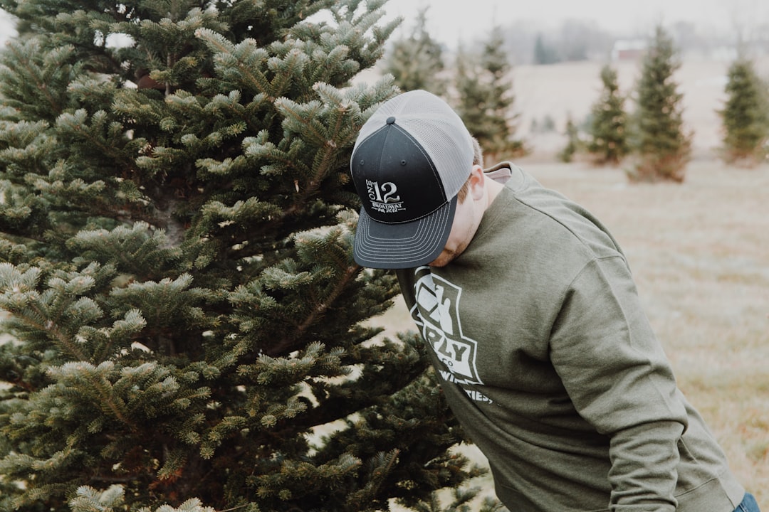 man beside pine tree