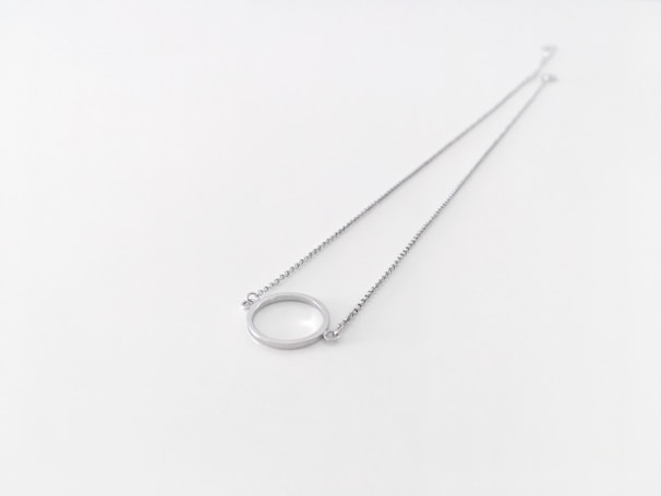 A delicate silver chain with a beautiful pendant.