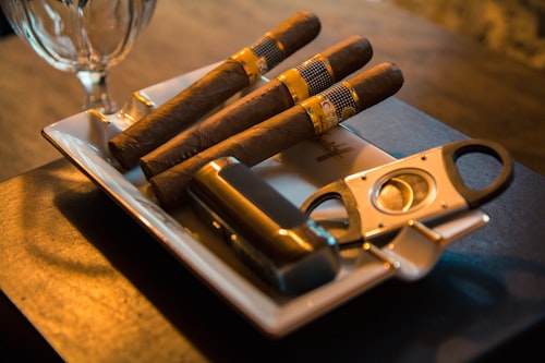 Cigars and cutter on ashtray