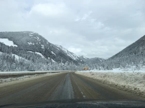 A snow-covered driveway being cleared by a professional snow removal service in Vail