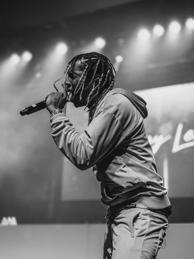 Rapper with microphone under stage lights