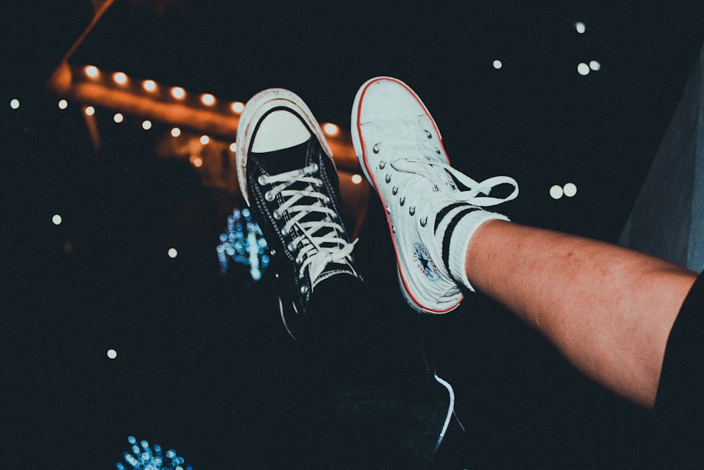 two unpaired white and black low-top sneakers