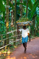 man carrying basket on head