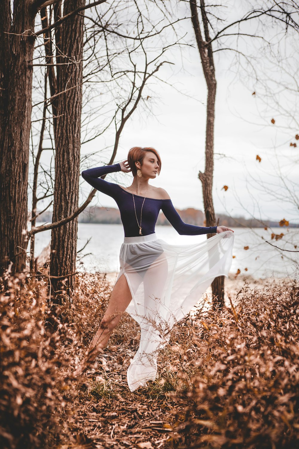 woman wearing blue one-piece bodysuit