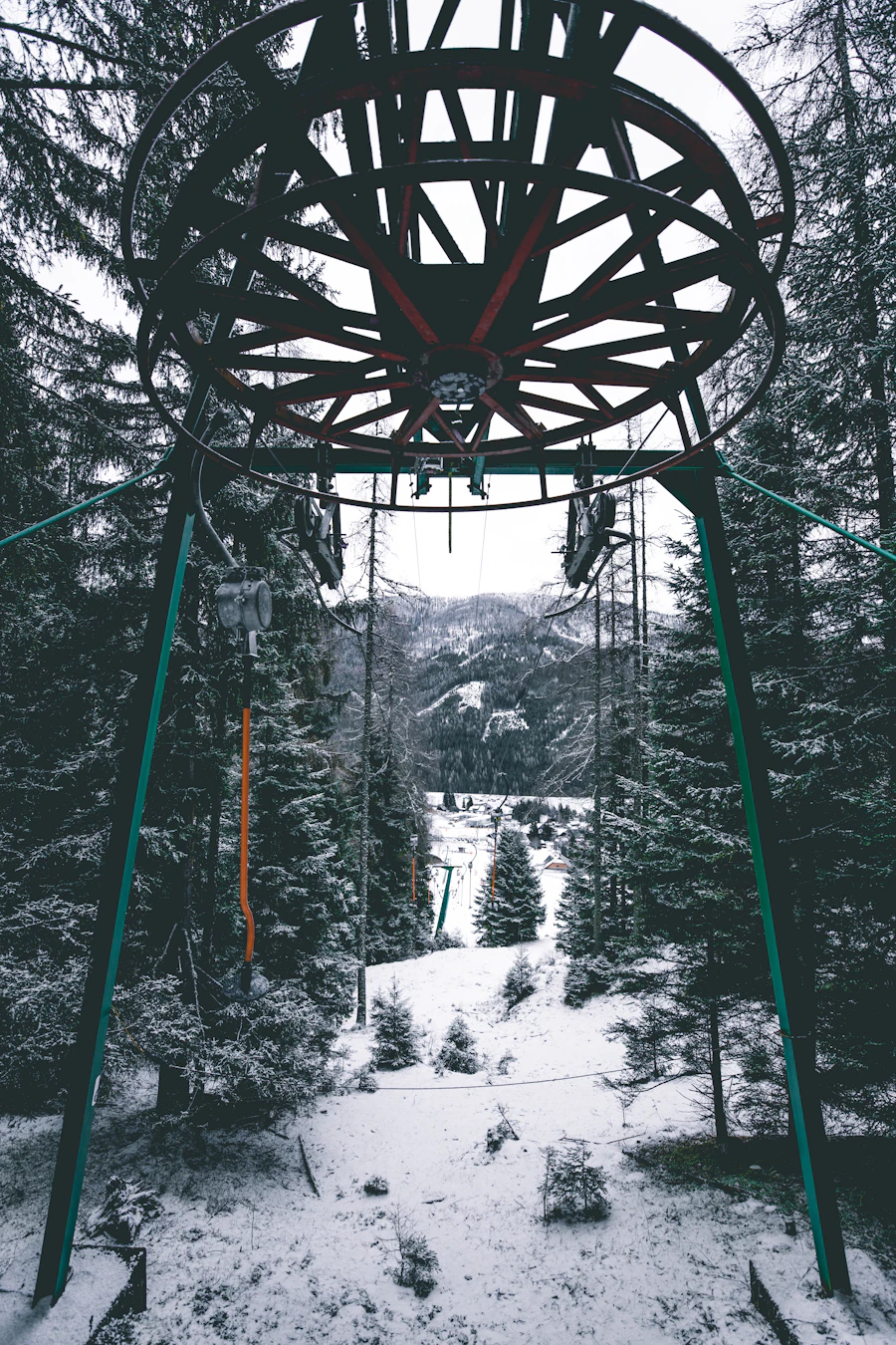Chairlift through a snowy forest