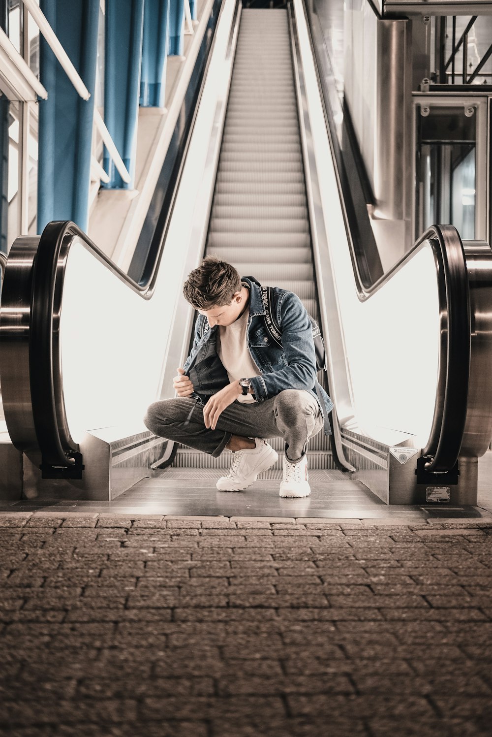 man sitting near elevator