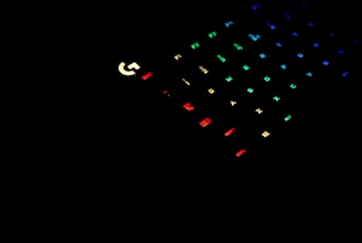 A sleek dark-themed digital gaming interface with vibrant green and blue highlights.