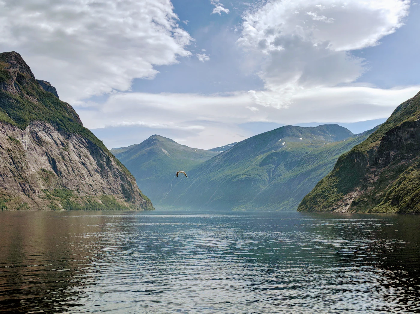 Calm waters of the Geirangerfjord ringed by mountains, Norway