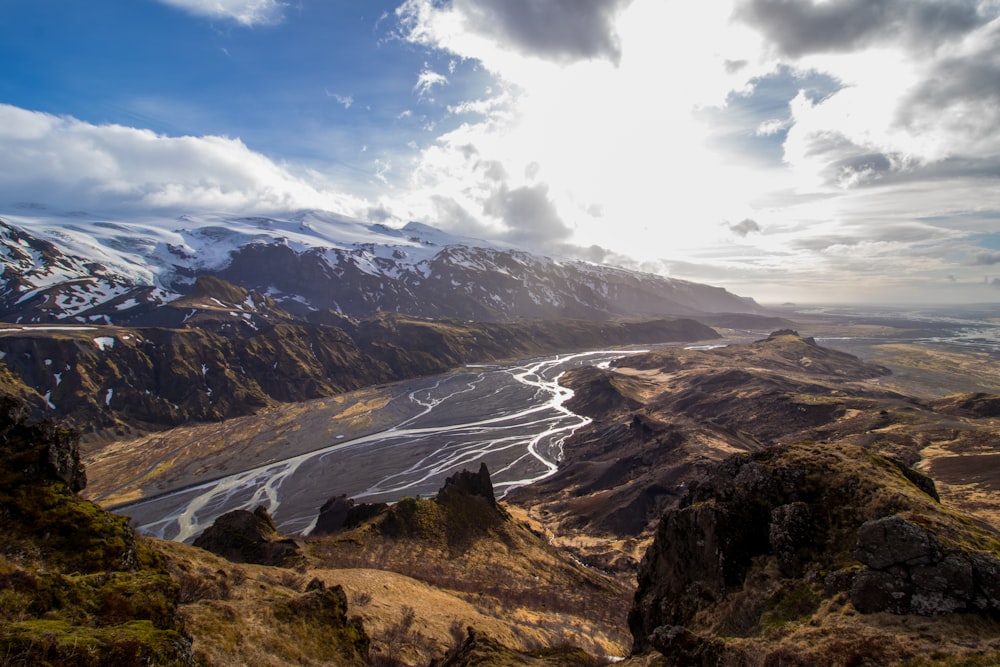 mountain near body of water during daytime