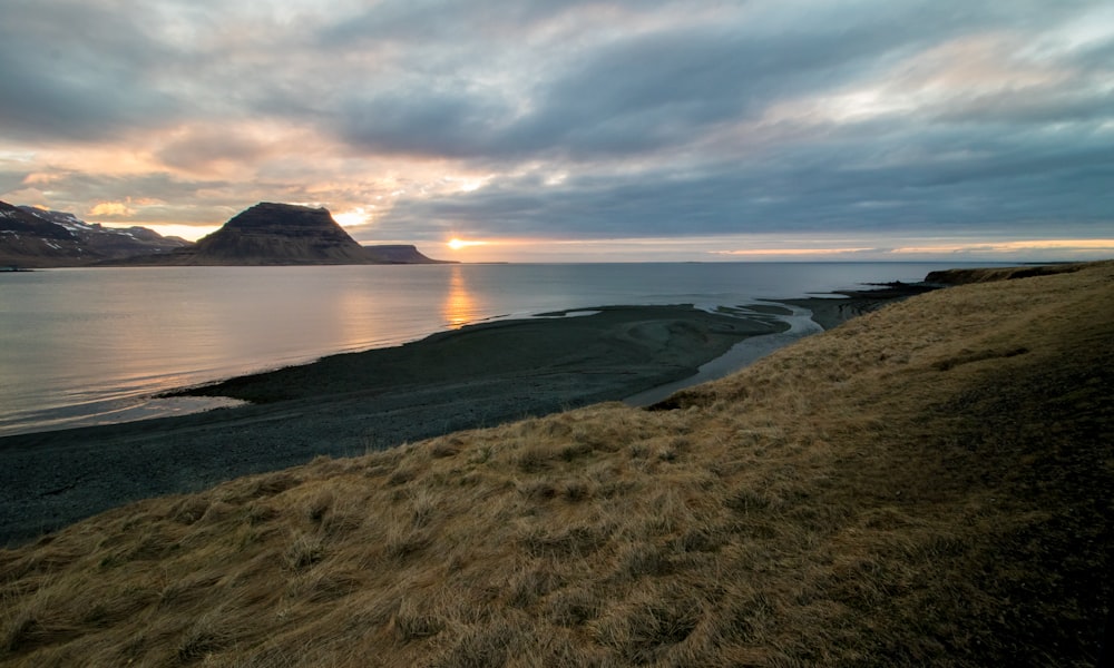 body of water during golden hour