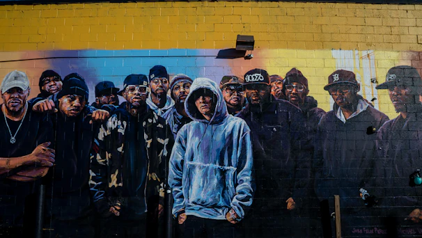 Youth collaborating on a mural design that depicts cultural heritage and unity.